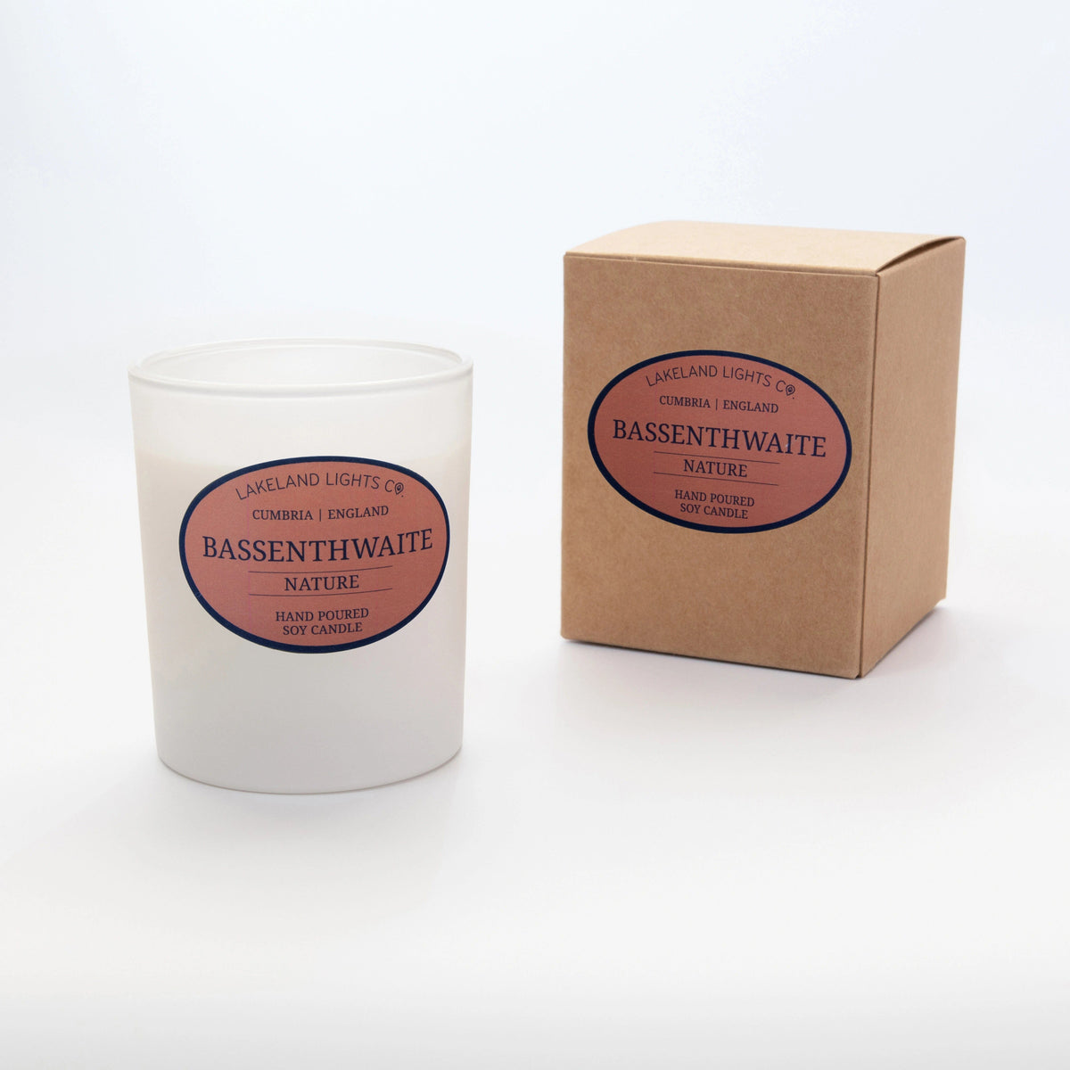 Two Bassenthwaite Nature soy candles by Lakeland Lights, featuring vetiver, black currant, and mulberry scent, medium and large sizes side by side.